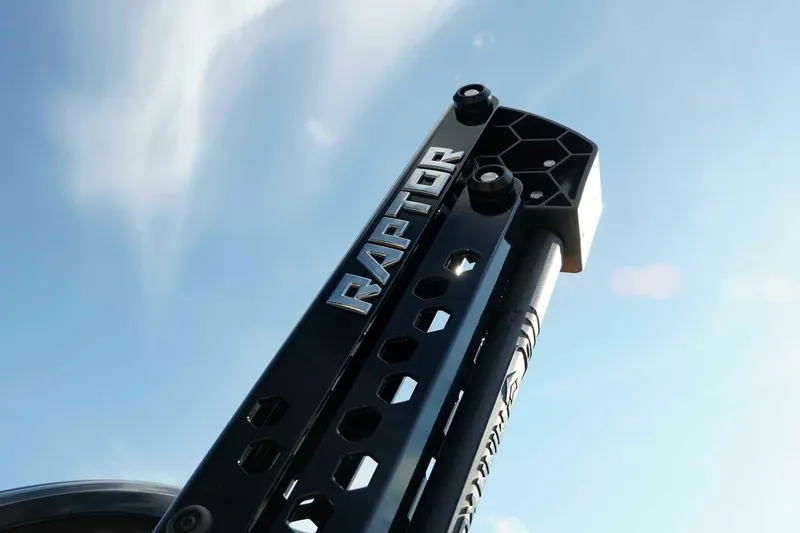 Slide: The Image of Raptor-branded component on Skeeter ZXE21, 2026 model, against a clear blue sky. - 8