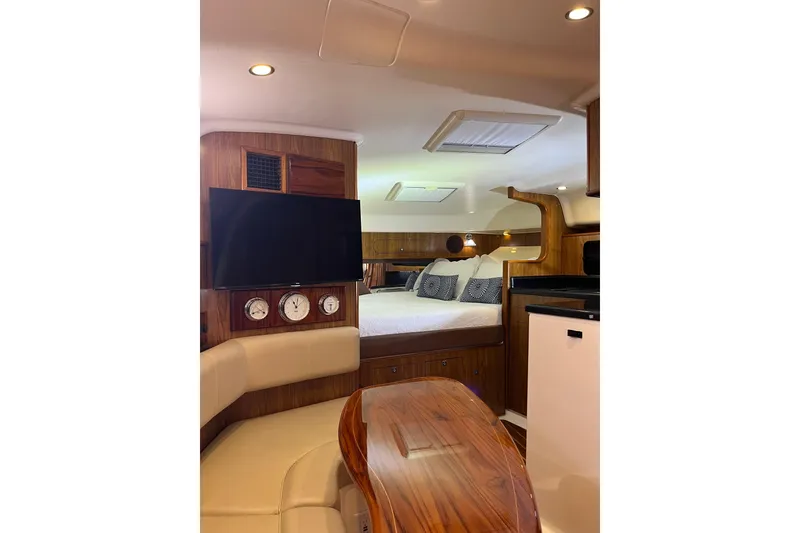Slide: The Image of Luxurious interior of 2009 Pursuit OS 375 Offshore boat with cozy seating and modern amenities. - 29