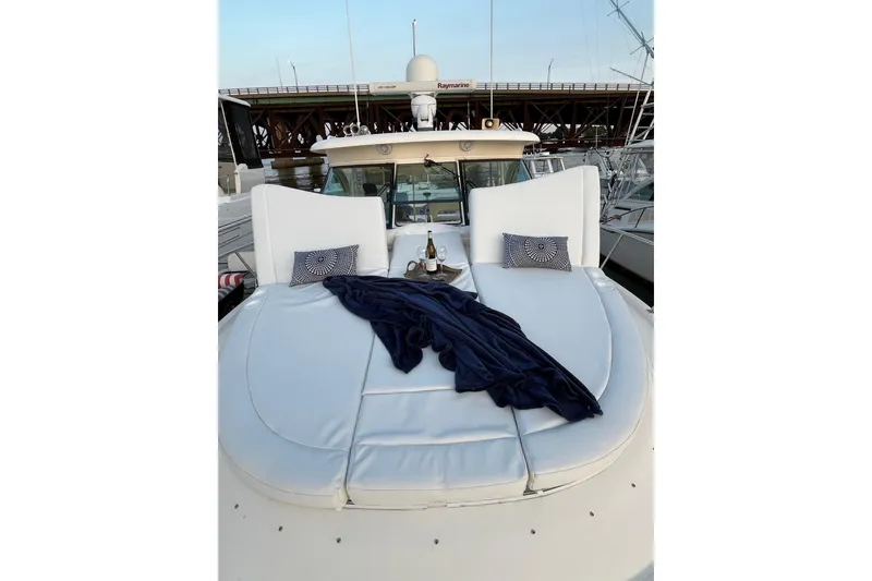 Slide: The Image of Luxurious 2009 Pursuit OS 375 Offshore yacht with elegant deck seating and cushions. - 33