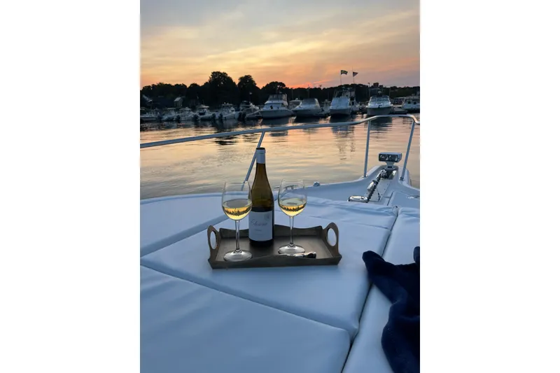 Slide: The Image of Wine and glasses on 2009 Pursuit OS 375 Offshore boat at sunset. - 36