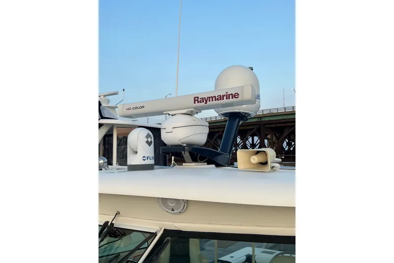 Slide: The Image of Radar and communication equipment on a 2009 Pursuit OS 375 Offshore boat. - 38