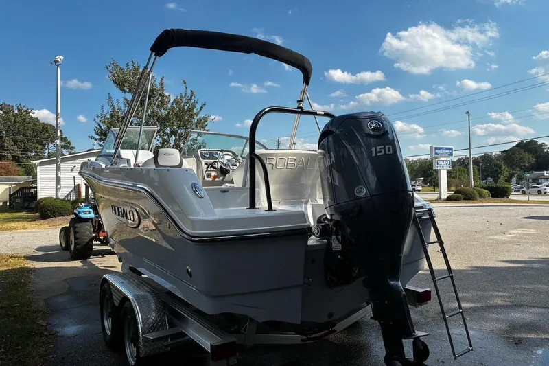 Slide: The Image of 2025 Robalo R207 Dual Console boat with Yamaha 150 engine on trailer. - 4