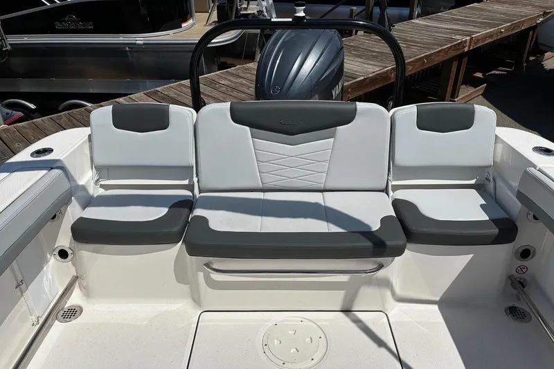 Slide: The Image of 2025 Robalo R207 Dual Console boat seating area with modern design and comfortable upholstery. - 8