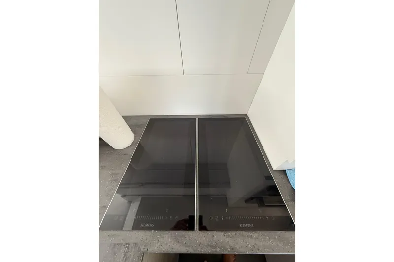 Slide: The Image of Modern Siemens induction cooktop on Fountaine Pajot MY6 2024 yacht kitchen counter. - 12