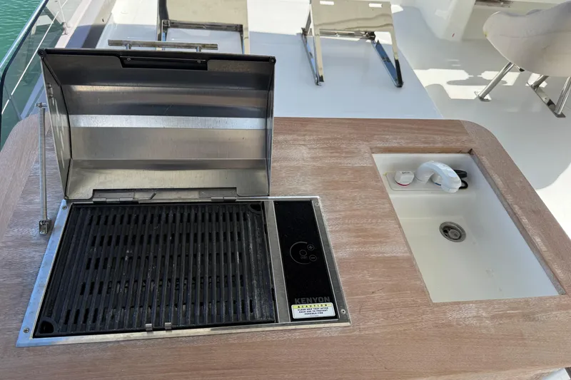 Slide: The Image of Outdoor grill and sink on 2024 Fountaine Pajot MY6 yacht deck. - 6