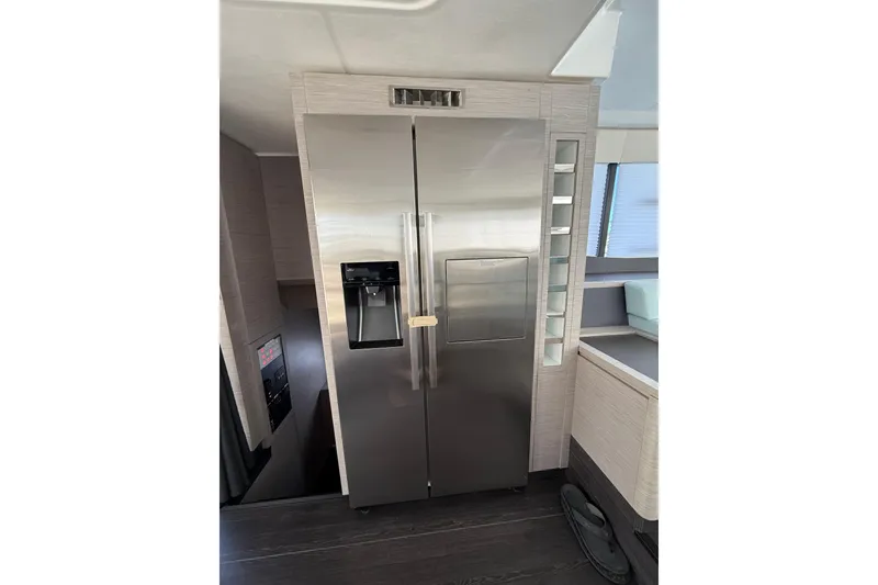 Slide: The Image of Modern kitchen with stainless steel refrigerator on 2024 Fountaine Pajot MY6 yacht. - 7