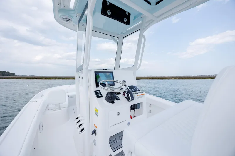 Slide: The Image of Interior view of Caymas 24 HB 2026 boat on the water. - 21