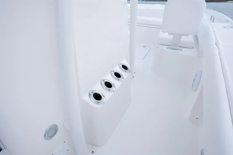 Slide: The Image of Interior view of 2026 Caymas 24 HB with rod holders. - 26