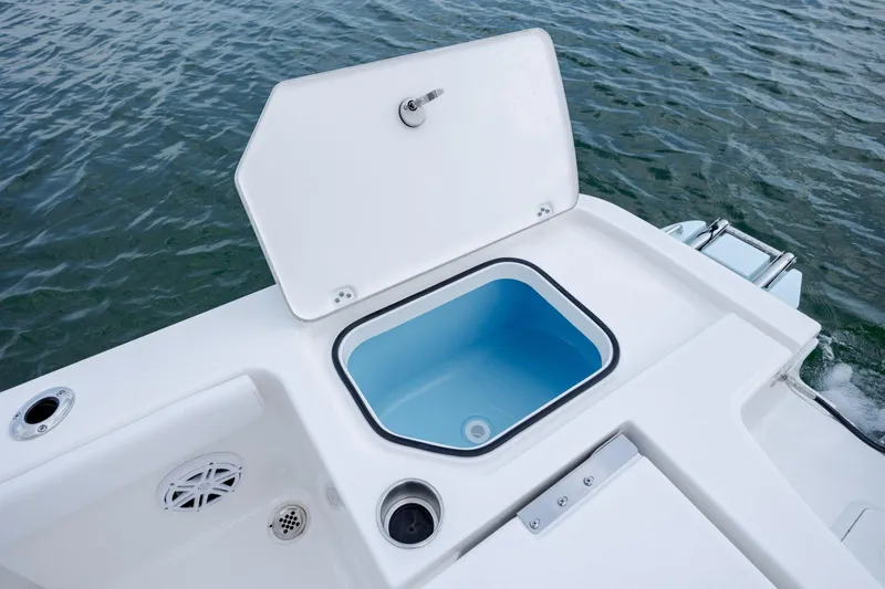 Slide: The Image of Open storage compartment on Caymas 24 HB boat, 2026 model. - 33