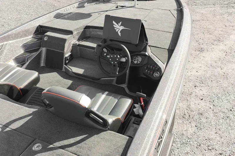 Slide: The Image of 2026 Skeeter ZXE20 boat interior with modern dashboard and seating. - 10