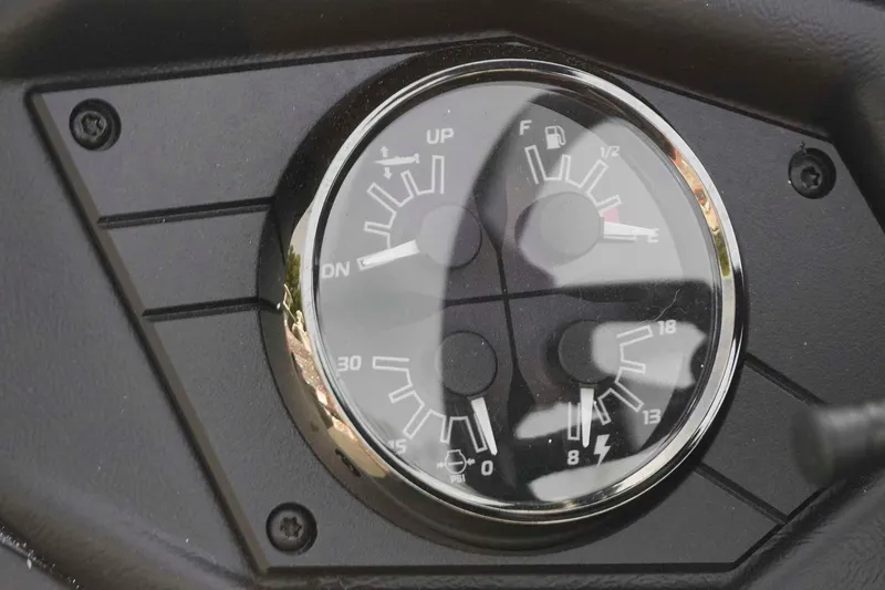 Slide: The Image of Dashboard gauges of a 2026 Skeeter ZXE20 boat, showing fuel and pressure levels. - 18