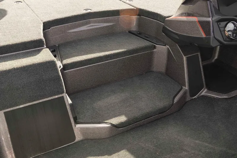 Slide: The Image of Interior view of 2026 Skeeter ZXE20 boat, featuring carpeted steps and sleek design. - 24