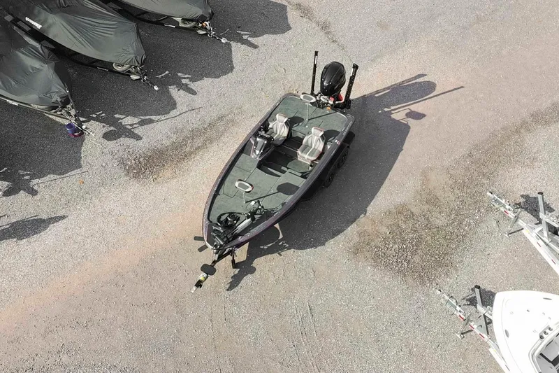 Slide: The Image of Aerial view of a 2026 Skeeter ZXE20 boat parked on gravel. - 3