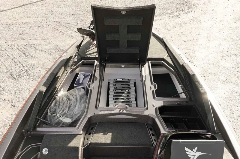 Slide: The Image of 2026 Skeeter ZXE20 boat interior with open storage compartments and organized tackle trays. - 30