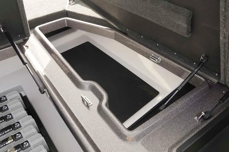 Slide: The Image of Storage compartment of 2026 Skeeter ZXE20 boat, featuring organized battery setup. - 33