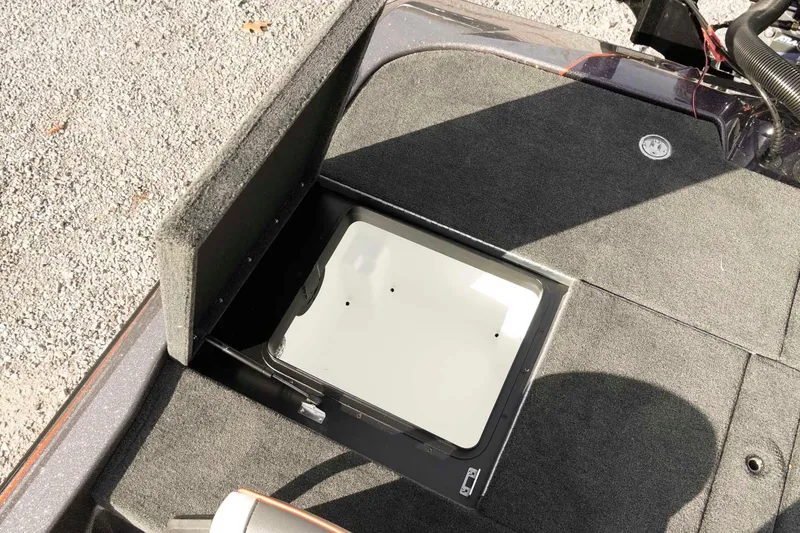 Slide: The Image of Open storage compartment on 2026 Skeeter ZXE20 boat deck. - 39