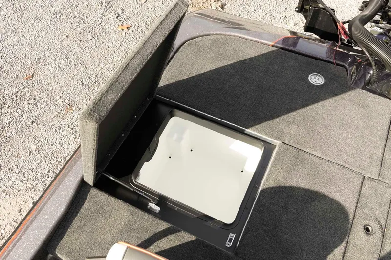 Slide: The Image of Open storage compartment on 2026 Skeeter ZXE20 boat deck. - 40