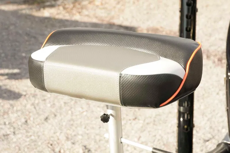 Slide: The Image of Skeeter ZXE20 2026 seat with black, white, and orange accents on a sunny day. - 43