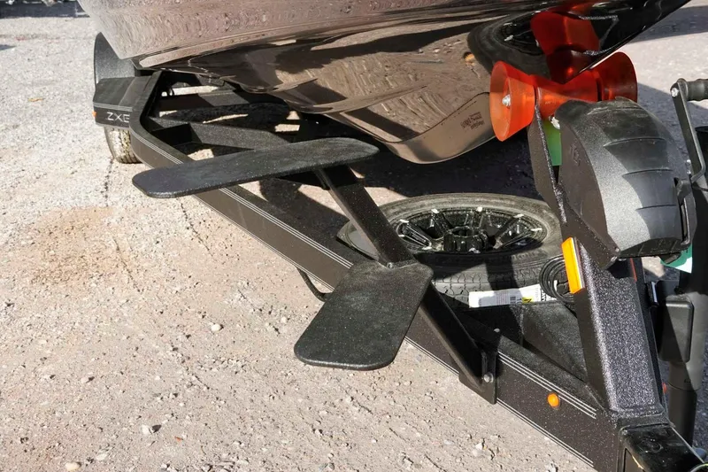 Slide: The Image of Trailer of 2026 Skeeter ZXE20 boat with wheel and support details. - 45