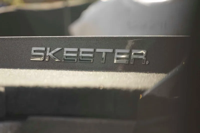 Slide: The Image of Close-up of 2026 Skeeter ZXE20 logo on a metallic surface. - 51