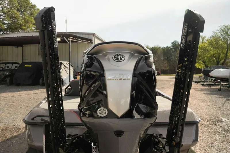 Slide: The Image of Skeeter ZXE20 2026 boat with powerful outboard motor in a sunny outdoor setting. - 6