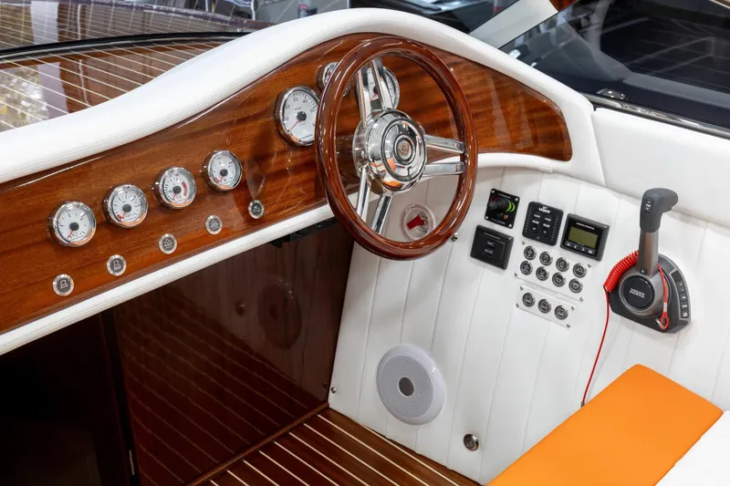 Slide: The Image of 2025 Comitti Venezia V28 dashboard with wooden accents and modern controls. - 10