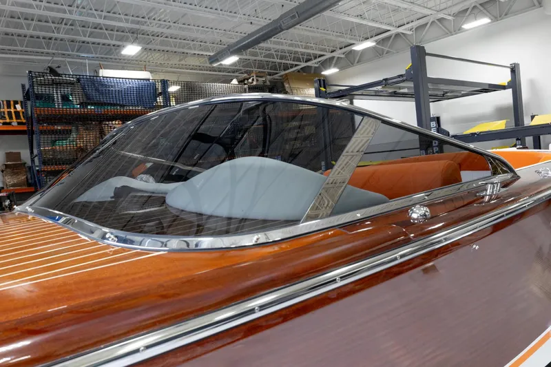 Slide: The Image of 2025 Comitti Venezia V28 luxury boat with sleek wooden finish and modern design. - 14