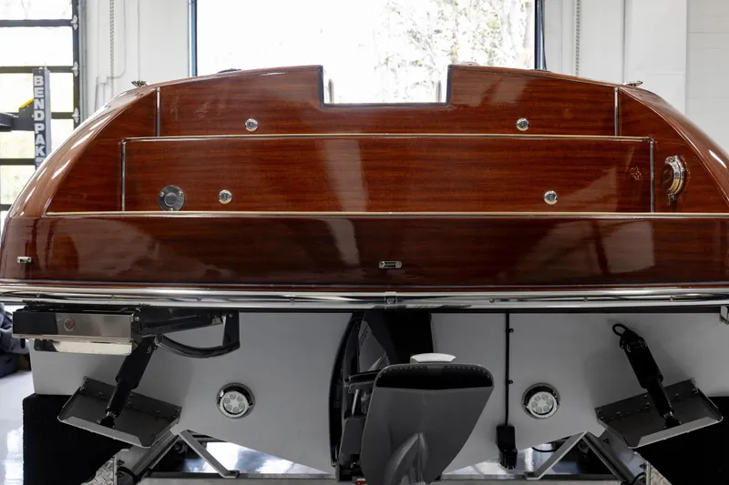 Slide: The Image of Rear view of 2025 Comitti Venezia V28 boat with polished wood finish. - 6