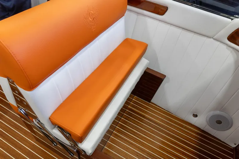 Slide: The Image of Luxury interior of 2025 Comitti Venezia V28 boat with orange and white seating. - 9