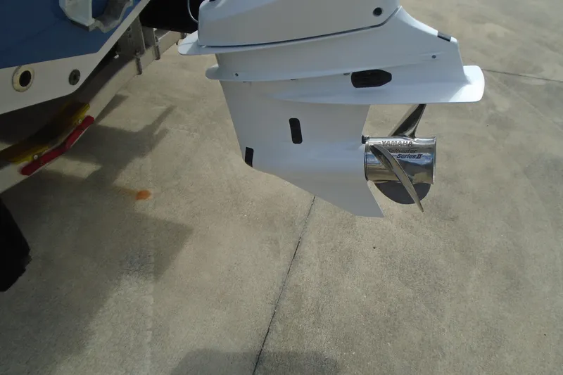 Slide: The Image of 2024 Sportsman Heritage 231 Center Console boat engine and propeller detail. - 5