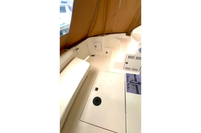 Slide: The Image of Interior view of 2001 Sea Ray 400 Sedan Bridge yacht with seating and storage. - 15