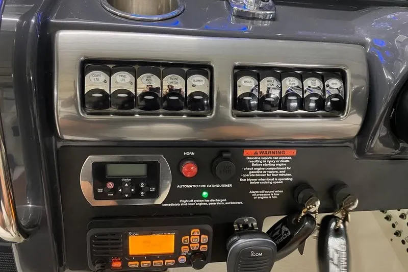 Slide: The Image of Control panel of a 2020 Formula 350 Sun Sport boat with switches and radio. - 15
