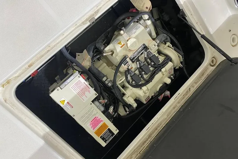 Slide: The Image of Engine compartment of a 2020 Formula 350 Sun Sport boat, showcasing mechanical components. - 16