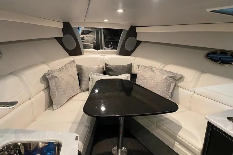 Slide: The Image of Luxurious interior of 2020 Formula 350 Sun Sport boat with plush seating and sleek table. - 17