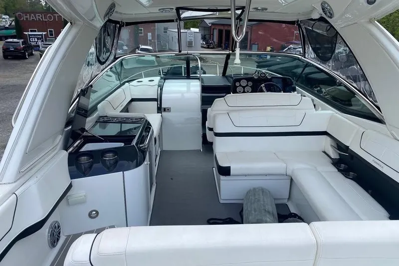 Slide: The Image of Interior of a 2020 Formula 350 Sun Sport boat with white seating and modern amenities. - 5