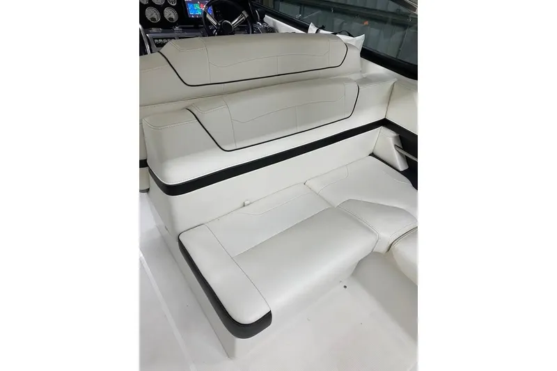Slide: The Image of 2020 Formula 350 Sun Sport boat interior with luxurious white seating and dashboard controls. - 9