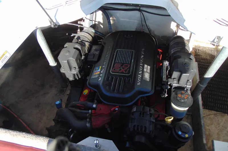 Slide: The Image of Engine compartment of a 2009 Monterey 214FS boat featuring a Volvo Penta 5.0 GXI engine. - 11