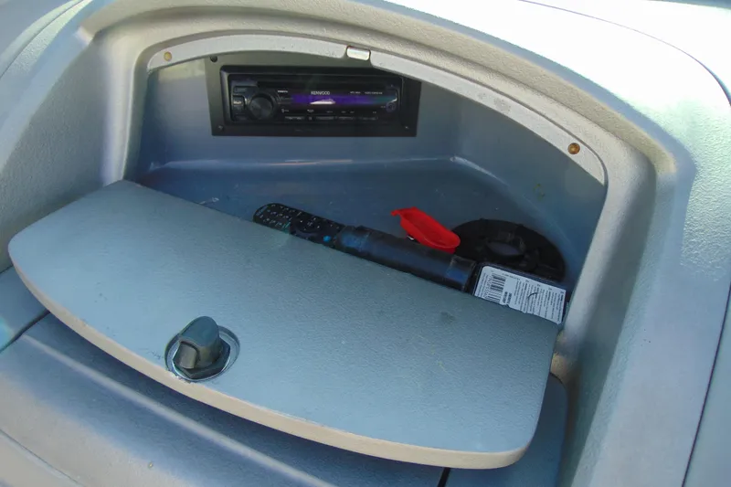 Slide: The Image of Storage compartment in a 2009 Monterey 214FS boat with stereo and remote control. - 14