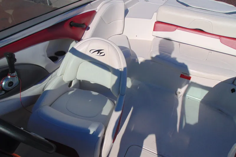 Slide: The Image of 2009 Monterey 214FS boat interior with white and red seating. - 20