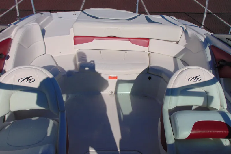 Slide: The Image of Interior of a 2009 Monterey 214FS boat with white and red seating. - 9