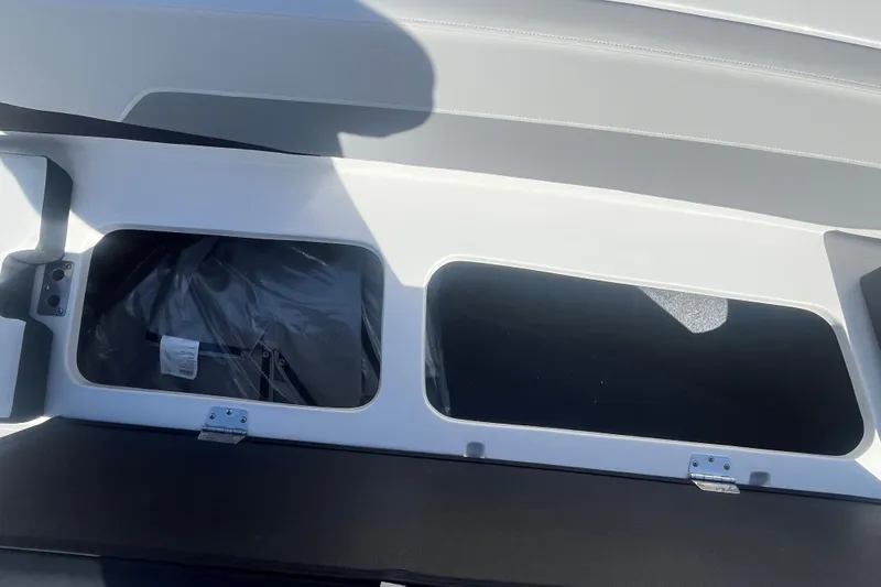 Slide: The Image of Open storage compartment in 2026 Starcraft SV 18 OB boat, showcasing interior space. - 13