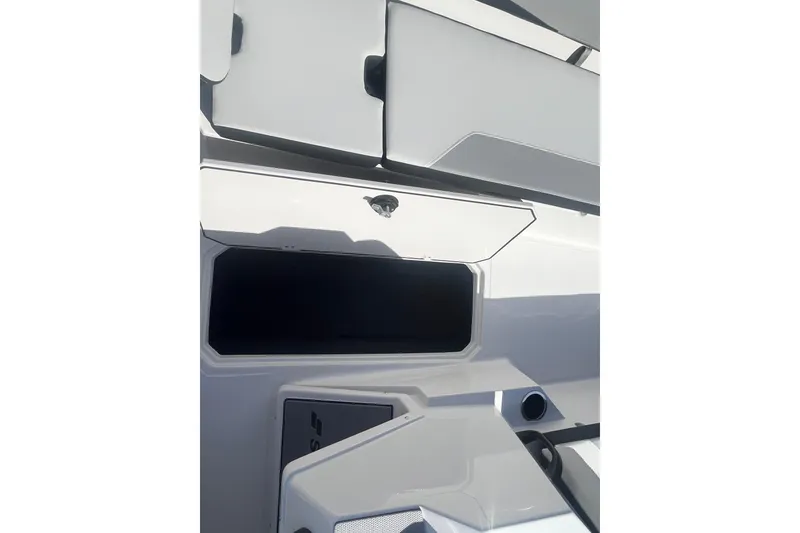 Slide: The Image of Interior view of 2026 Starcraft SV 18 OB boat storage compartments. - 16