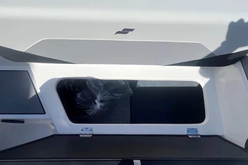 Slide: The Image of 2026 Starcraft SV 18 OB boat storage compartment with open hatch, showcasing interior space. - 18