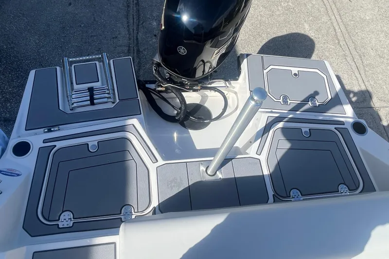 Slide: The Image of 2026 Starcraft SV 18 OB boat deck with motor and storage compartments. - 19