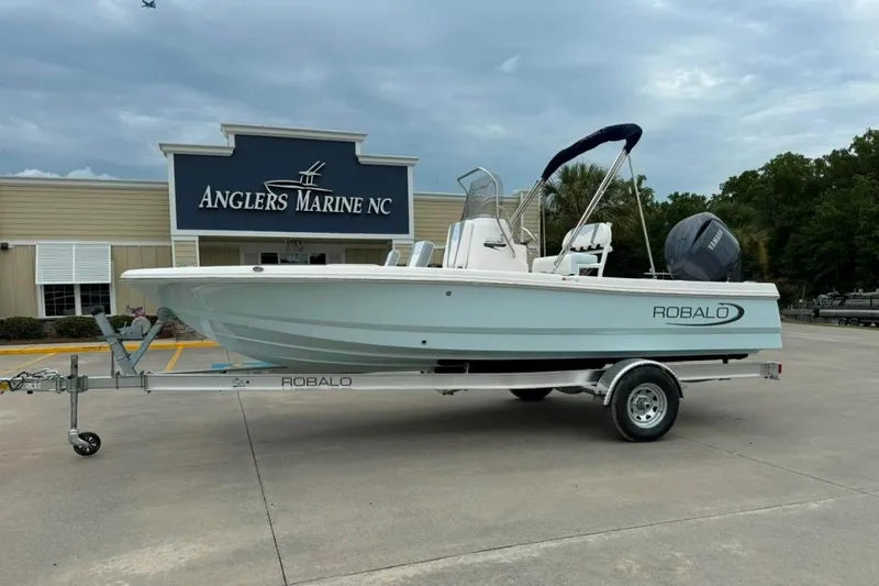 The Image of 2026 Robalo 206 Cayman boat on trailer at Anglers Marine NC dealership. - 0