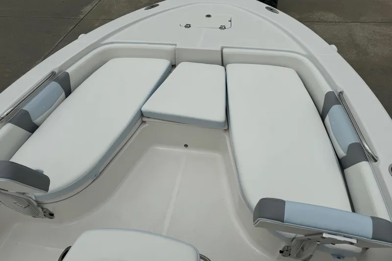 Slide: The Image of 2026 Robalo 206 Cayman boat interior with cushioned seating and sleek design. - 11