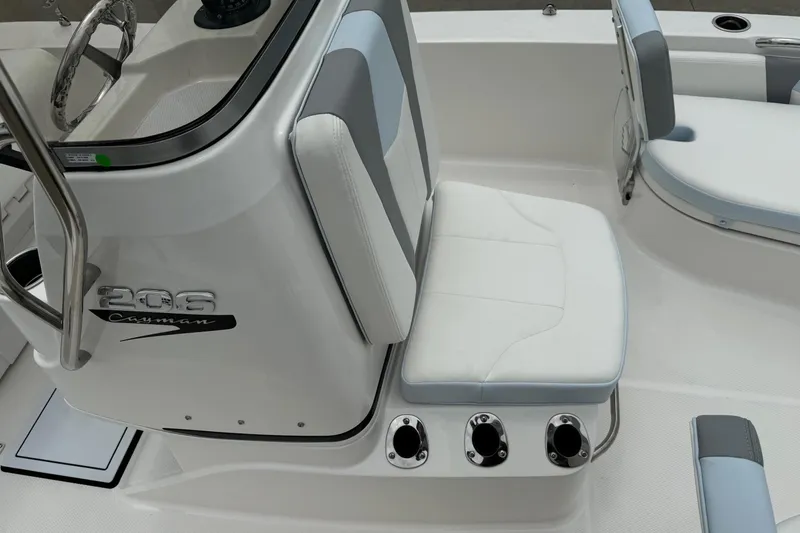 Slide: The Image of 2026 Robalo 206 Cayman boat interior with seating and steering wheel. - 12