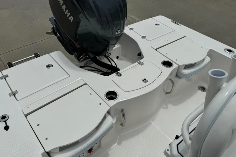 Slide: The Image of 2026 Robalo 206 Cayman boat deck with Yamaha engine, featuring storage compartments. - 14
