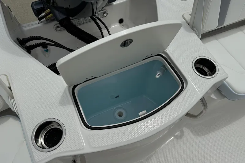 Slide: The Image of Livewell compartment on 2026 Robalo 206 Cayman boat, featuring cup holders and sleek design. - 15