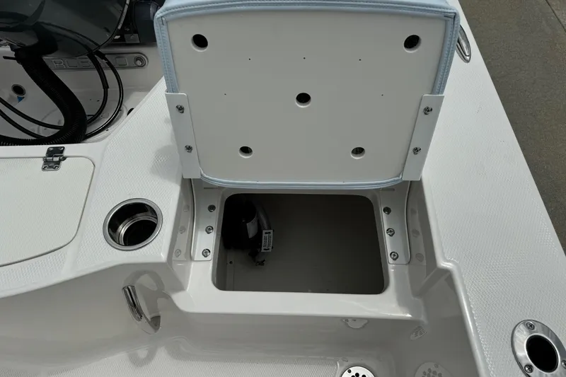 Slide: The Image of Open storage compartment on 2026 Robalo 206 Cayman boat, showcasing interior space and design. - 18